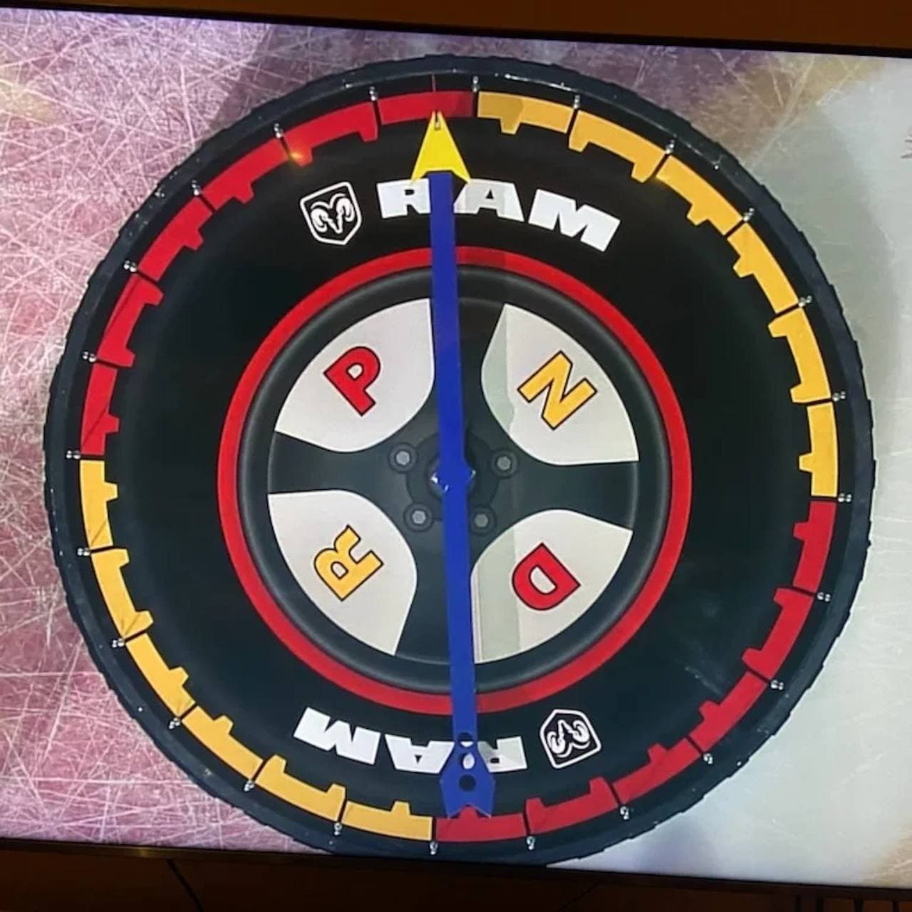 Dodge Ram contest prize wheel at a Calgary Flames game where Alex's yellow N section narrowly missed winning a truck